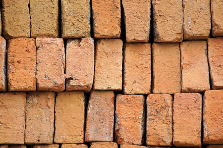 Red bricks are stacked together in one beautiful package.の写真素材