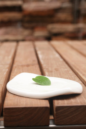 White ceramic with green leafの素材