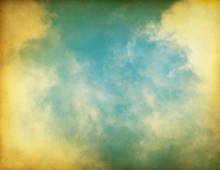 Fog, clouds, and sky on a textured vintage paper background.の写真素材