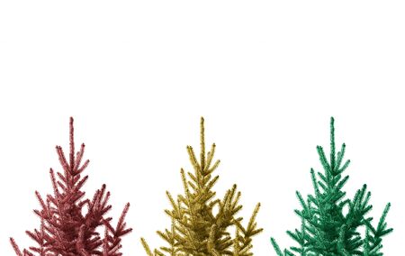 Three Christmas trees isolated on a white background.の写真素材