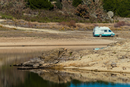 mobile home at a riverの写真素材