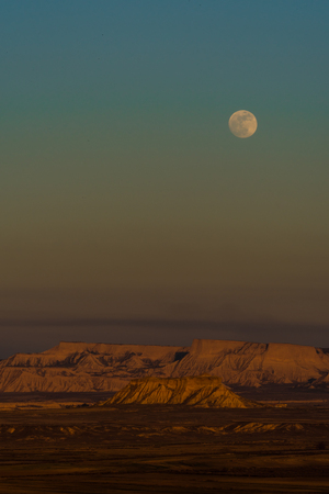 Fullmoon in Berdenas Reales desert in Navarraの写真素材