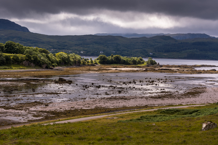 Typical landscape with coast and pastures on the Gaelic peninsula Applecross, Strathcarron, Inner Hebrides, Scotland, UKの写真素材