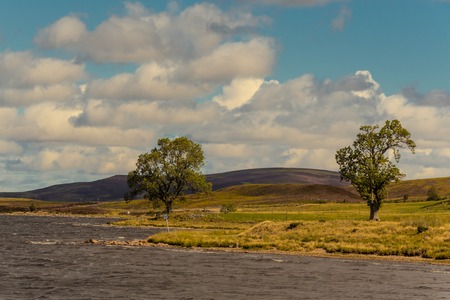typical hinterland on the east coast with small lakes, Sutherland, Highlands, Scotlandの写真素材