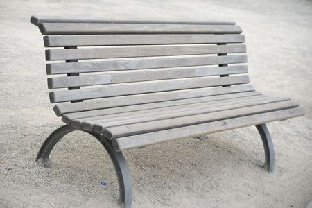 A Single Wooden Bench in the Park.の写真素材