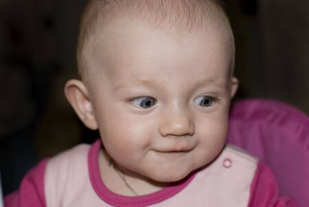 Portrait of cute funny Baby over black background.の写真素材