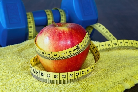 Equipments and fruits to maintain good fitness and optimum weight. Workout as a healthy way of life.の写真素材
