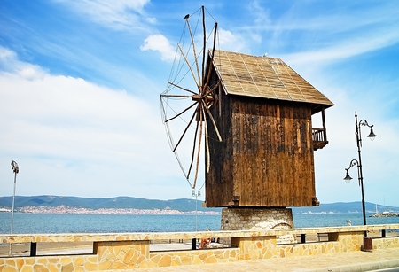 A wooden windmill at the entrance to the Old town of Nesebar.の写真素材