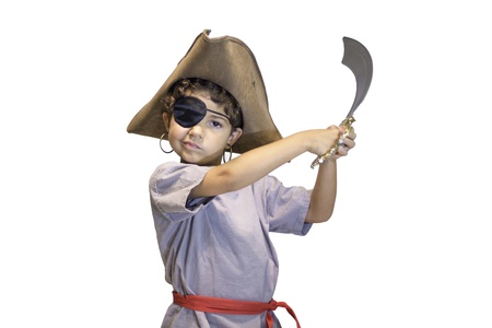 A small child dressed like a pirate holding a toy sword の写真素材