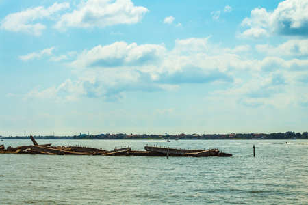 Large pieces of concrete setup as a reef to prevent boaters from entering that area.の写真素材