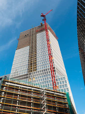 Frankfurt, Hessen Germany - 04.03.2021: The yet unfinished construction site of the ONE tower in the...