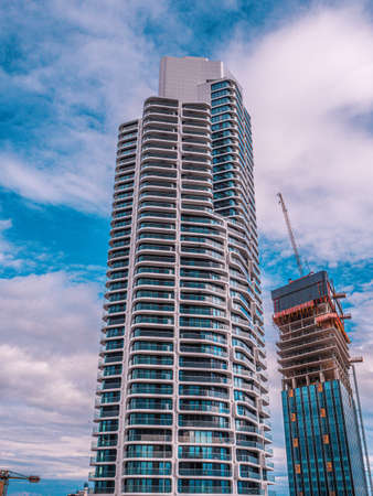 Frankfurt, Hessen Germany - May 15, 2021: The Grand Tower rises in the sky. The skyscraper offers many expensive apartments and office space for companies in the Europaviertel in Frankfurt am Main.のeditorial素材