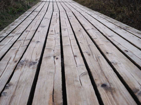 A wood-planked footpath leads directly through the dunes to the wonderful beach of Sylt.の写真素材
