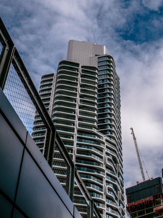 Frankfurt, Hessen Germany â May 15, 2021: The Grand Tower rises in the sky. The skyscraper offers many expensive apartments and office space for companies in the Europaviertel in Frankfurt am Main.のeditorial素材