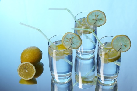 Mineral water with lemon and reflectionの写真素材