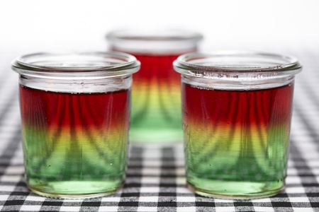 Traffic light jello made of three layers jello: green (woodruff), yellow (lemon) and red (raspberry).の写真素材