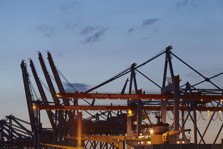 Container gantry cranes at the terminal Burchardkai in the deepwater port Hamburg-Waltershof taken in the evening of May 2014, 15.のeditorial素材