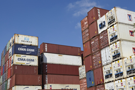 A pile of containers (FEU) and refrigerated containers at the Port of Hamburg taken at bright...