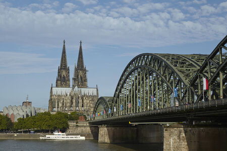 The Cologne Cathedral (Northrhine-Westphalia, Germany) and the Hohenzollern Bridge at the river Rhine taken on August 17, 2014.のeditorial素材