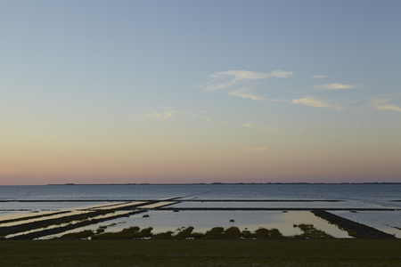 Sunset over the North Sea near Noderfriedrichskoog (North Frisia, Schleswig-Holstein, Germany) taken from the dyke.の写真素材