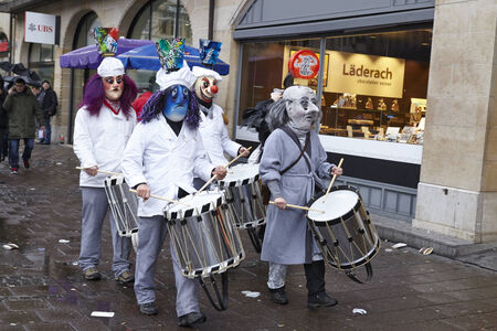 The Carnival at Basel (Basle - Switzerland) in the year 2015. The picture shows some costumed people on February 23, 2015. The Carnival at Basel (Basle - Switzerland) in the year 2015. The picture shows some costumed people on February 23, 2015.