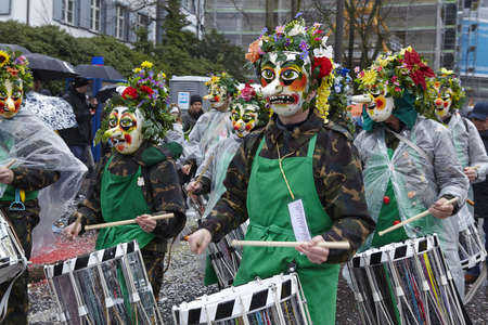 The Carnival at Basel (Basle - Switzerland) in the year 2015. The picture shows some costumed people on February 23, 2015. The Carnival at Basel (Basle - Switzerland) in the year 2015. The picture shows some costumed people on February 23, 2015.