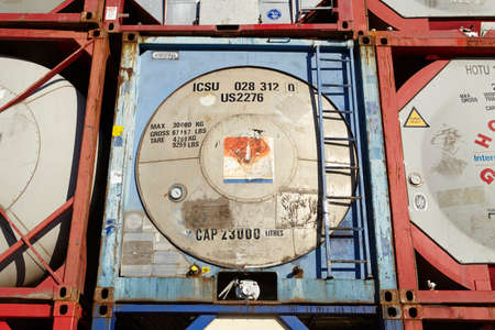 A pile of tank container (tanktainer) of different haulage firms taken at the port of Hamburg against a bright blue sky on March 8, 2015.のeditorial素材