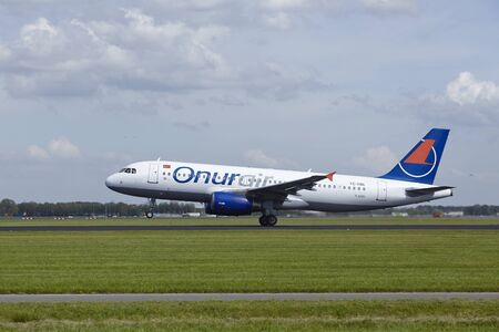 An Airbus A320-232 of Onur Air takes off at Amsterdam Airport Schiphol (The Netherlands, AMS) on May 13, 2015. The name of the runway is Polderbaan.のeditorial素材