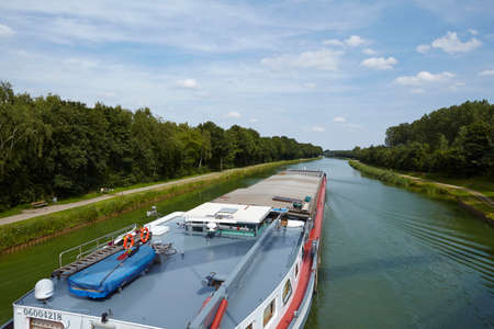 The inland cargo vessel Ortelius sails on the Mittelland Canal at Bramsche (Germany, Lower Saxony) on August 1, 2015.のeditorial素材