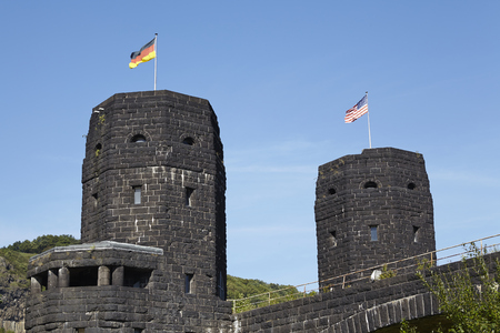 The flags of the Allies and Germany blow on the both towers of The Remagen Bridge (Germany, Rhineland-Palatinate, administrative district Ahrweiler) which was destroyed at the second world war.のeditorial素材