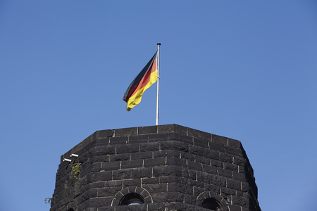 The flag of Germany blows on the tower of The Remagen Bridge (Germany, Rhineland-Palatinate, administrative district Ahrweiler) which was destroyed at the second world war.のeditorial素材