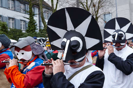 Some fully costumed carnival activists walk through the city during the carnival procession...