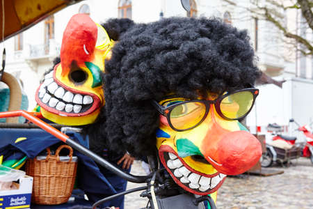 A face mask lays on a bicycle at the Carnivel at Basel 2016 (Basle - Switzerland) on February 15, 2016.のeditorial素材
