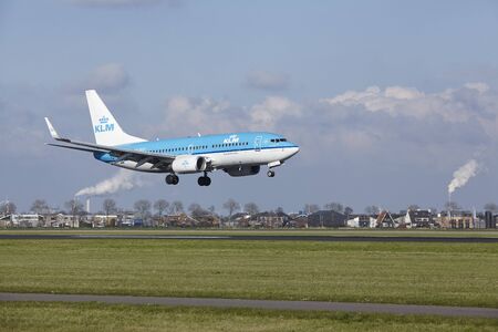 The KLM Boeing 737-7K2 with identification PH-BGQ lands at Amsterdam Airport Schiphol (The Netherlands, AMS), Polderbaan on April 8, 2016.のeditorial素材