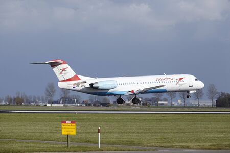 The Austrian Airlines Fokker 100 with identification OE-LVM lands at Amsterdam Airport Schiphol (The Netherlands, AMS), Polderbaan on April 8, 2016.のeditorial素材