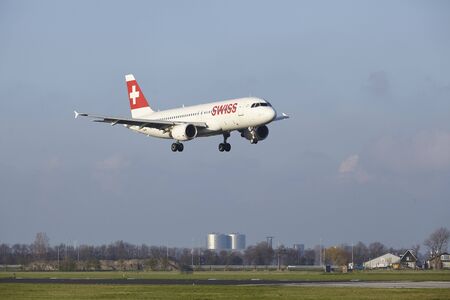 The SWISS Airbus A320-214 with identification HB-IJR lands at Amsterdam Airport Schiphol (The Netherlands, AMS), Polderbaan on April 8, 2016.のeditorial素材