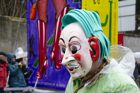 A fully costumed carnival activist walks through the city during the carnival procession (cortege) of the Carnivel at Basel 2017 (Basle - Switzerland) on March 6, 2017.のeditorial素材