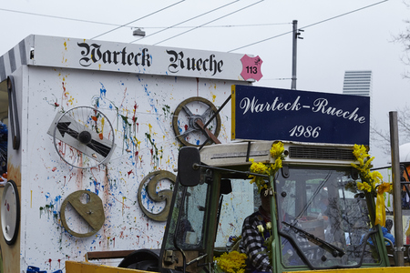 A carnival waggon drives through the city during the carnival procession (cortege) of the Carnivel at Basel 2017 (Basle - Switzerland) on March 6, 2017.のeditorial素材