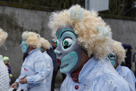 Some fully costumed carnival activists walk through the city during the carnival procession (cortege) of the Carnivel at Basel 2017 (Basle - Switzerland) on March 6, 2017.のeditorial素材