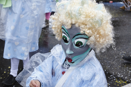 A fully costumed carnival activist walks through the city during the carnival procession (cortege) of the Carnivel at Basel 2017 (Basle - Switzerland) on March 6, 2017.のeditorial素材