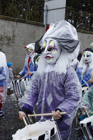 A fully costumed carnival activist walks through the city during the carnival procession (cortege) of the Carnivel at Basel 2017 (Basle - Switzerland) on March 6, 2017.のeditorial素材