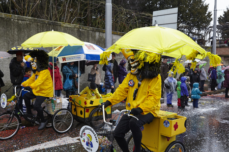 Some fully costumed carnival activists walk through the city during the carnival procession (cortege) of the Carnivel at Basel 2017 (Basle - Switzerland) on March 6, 2017.のeditorial素材