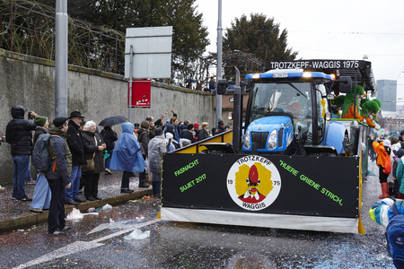 A carnival waggon drives through the city during the carnival procession (cortege) of the Carnivel at Basel 2017 (Basle - Switzerland) on March 6, 2017.のeditorial素材