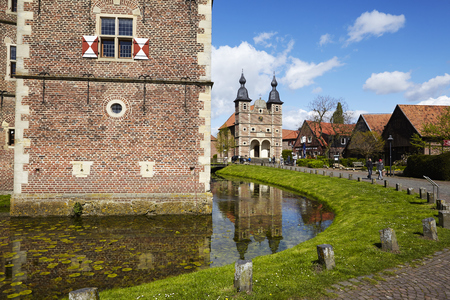 The wall of moated castle Raesfeld (County Borken, Northrhine-Westphalia, Germany) amd chapel St. Sebastian on April 2017, 17.のeditorial素材