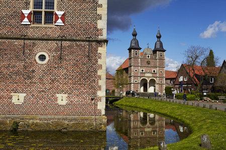 The wall of moated castle Raesfeld (County Borken, Northrhine-Westphalia, Germany) amd chapel St. Sebastian on April 2017, 17.のeditorial素材