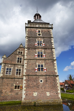 The tower of the moated castle Raesfeld (County Borken, Northrhine Westphalia, Germany) rises into the sky on April 2017, 17.のeditorial素材