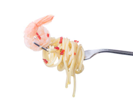 Pasta with shrimp on a fork. Isolated on a white の写真素材