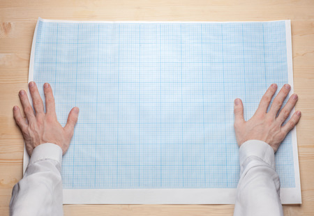 two man hands holding empty blueprint canvas