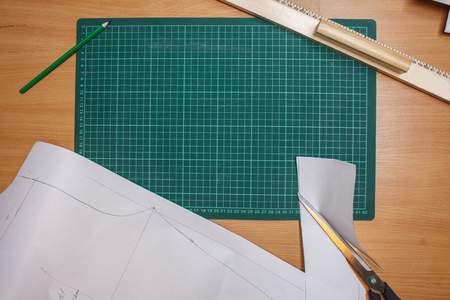 blank measuring tablet arrounded stationery devices ruller, pencil, scissors, dress pattern, top view flat layの写真素材