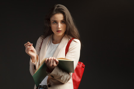 young attractive female journalist interviews on black backgroundの写真素材